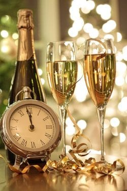Clock, champagne and glasses