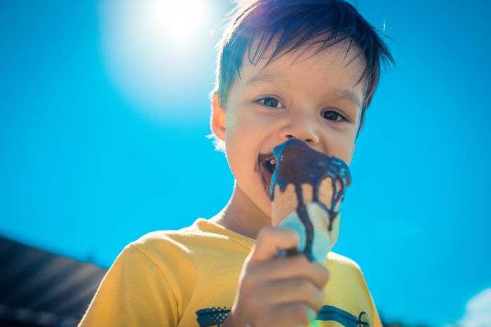child enjoying ice cream cone